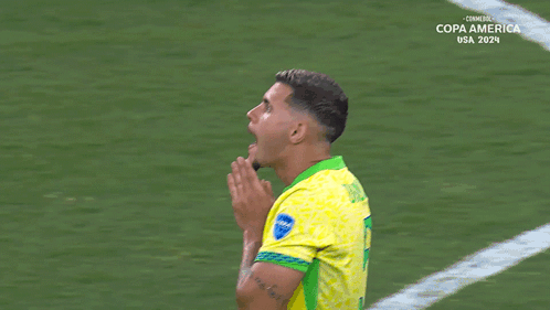 A Soccer Player Wearing A Yellow And Green Jersey With The Word Copa America On It GIF