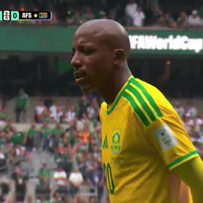 A Soccer Player Wearing A Yellow And Green Shirt With The Number 10 On It GIF