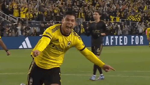 A Soccer Player Wearing A Yellow Jersey That Says Adidas On It GIF
