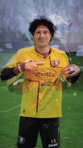 A Soccer Player Wearing A Yellow Jersey That Says Motta GIF