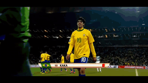a soccer player wearing a yellow jersey with the number 10 on it