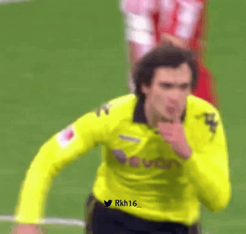 A Soccer Player Wearing A Yellow Jersey With The Number 16 On The Front GIF