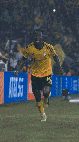 A Soccer Player Wearing A Yellow Jersey With The Number 34 On It GIF