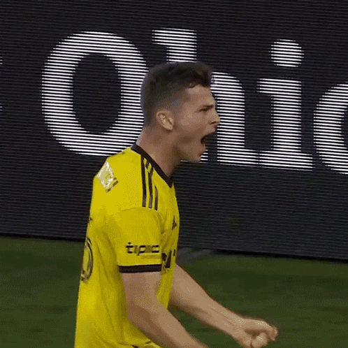 A Soccer Player Wearing A Yellow Jersey With The Word Tipc On The Sleeve GIF