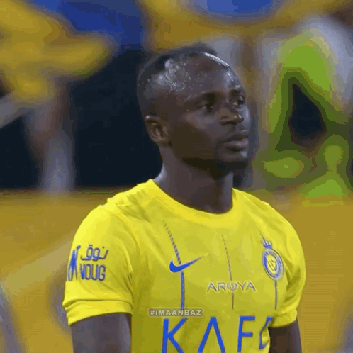 A Soccer Player Wearing A Yellow Shirt That Says Arya On It GIF