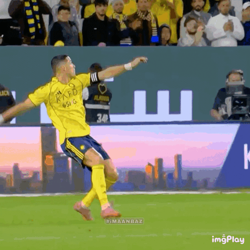 A Soccer Player Wearing A Yellow Shirt That Says Kaed On It GIF