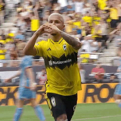 A Soccer Player Wearing A Yellow Shirt That Says Nationwide GIF