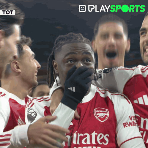A Soccer Player Wearing An Arsenal Jersey Covers His Mouth With His Hand GIF