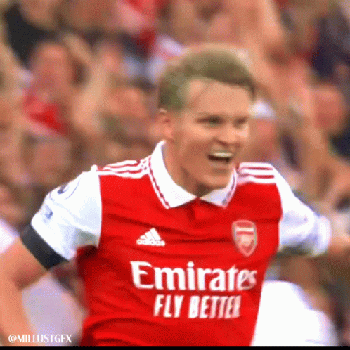 A Soccer Player Wearing An Emirates Fly Better Jersey Celebrates GIF