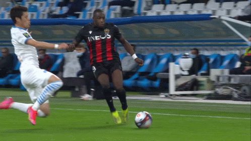 A Soccer Player Wearing An Ineos Jersey Dribbles A Ball GIF