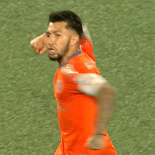 A Soccer Player Wearing An Orange Jersey With The Word Capital On The Sleeve GIF