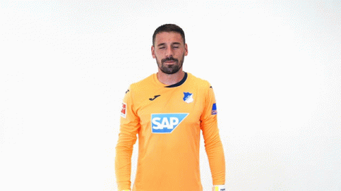 A Soccer Player Wearing An Orange Shirt With The Word Sap On It GIF