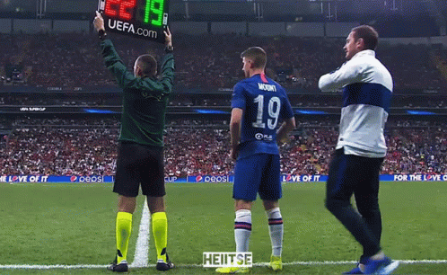 A Soccer Player Wearing Number 19 Stands On The Field GIF
