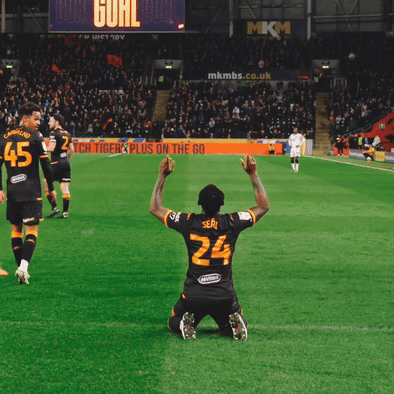A Soccer Player Wearing Number 24 Kneeling On The Field GIF