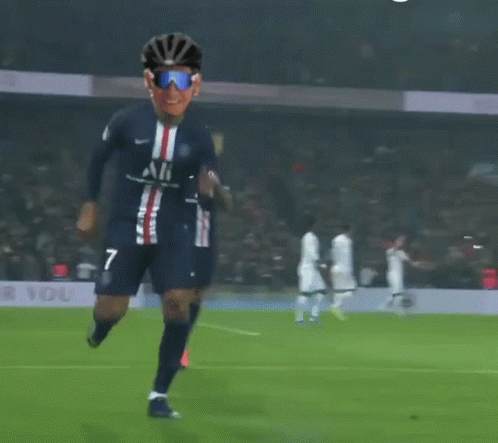 A Soccer Player Wearing Sunglasses And A Helmet With The Number 7 On His Jersey GIF