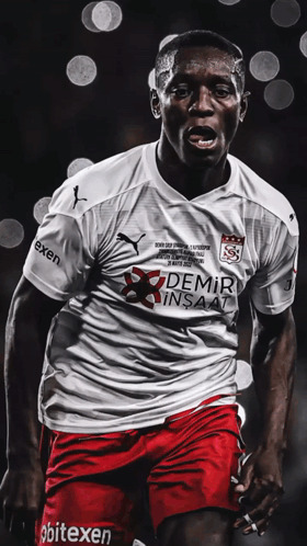 A Soccer Player Wears A White Shirt With Demir Insaat On It GIF