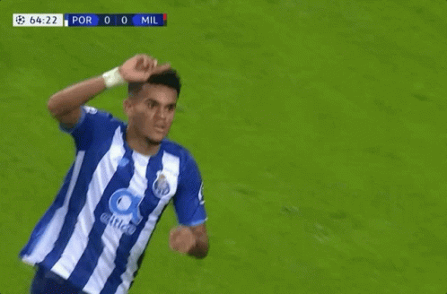 A Soccer Player Wipes His Face With His Hand During A Game GIF