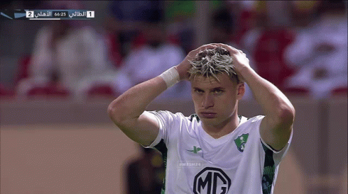 A Soccer Player With A Mc Logo On His Shirt Holds His Head GIF