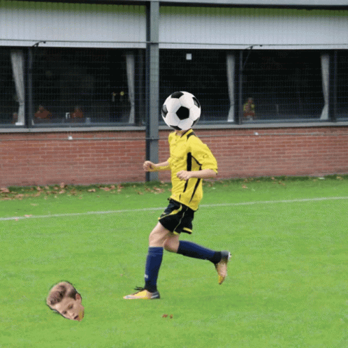 A Soccer Player With A Soccer Ball On His Head In Front Of A Brick Wall GIF
