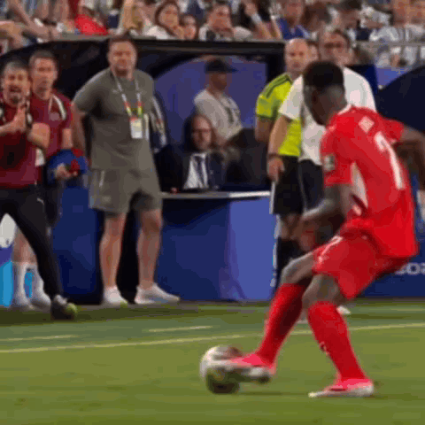 A Soccer Player With The Number 1 On His Jersey Is Kicking A Ball GIF