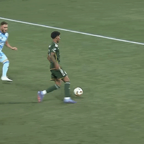 A Soccer Player With The Number 1 On His Jersey Kicks The Ball GIF