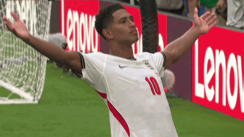 A Soccer Player With The Number 10 On His Jersey Is Celebrating GIF