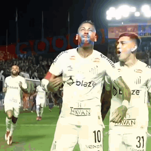A Soccer Player With The Number 10 On His Jersey Is Celebrating GIF