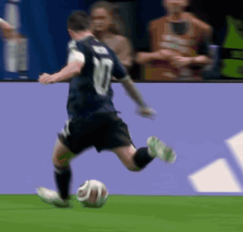 A Soccer Player With The Number 10 On His Jersey Is Kicking A Soccer Ball GIF