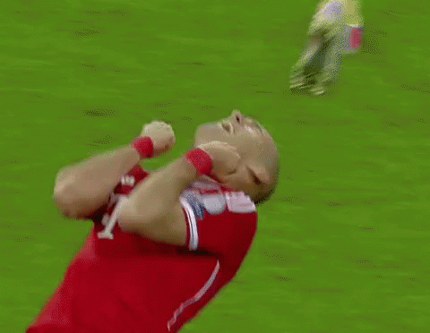 a soccer player with the number 10 on his jersey is kneeling down on the field