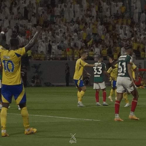 A Soccer Player With The Number 10 On His Jersey Stands On The Field GIF