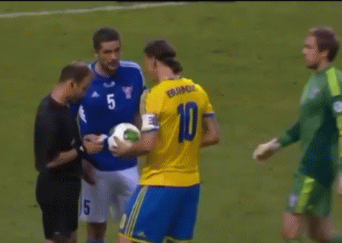 A Soccer Player With The Number 10 On His Jersey Talks To Another Player GIF