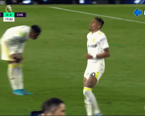 a soccer player with the number 10 on his shorts is running on a field