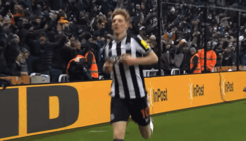 A Soccer Player With The Number 10 On His Shorts Is Running On A Field GIF