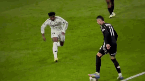 a soccer player with the number 11 on his jersey is running on the field .