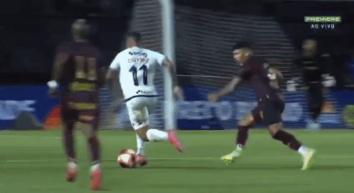 A Soccer Player With The Number 11 On His Jersey Kicks The Ball GIF