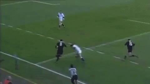 A Soccer Player With The Number 11 On His Shirt Is Laying On The Ground . GIF