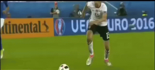 A Soccer Player With The Number 13 On His Jersey Kicks A Soccer Ball GIF