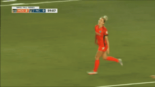 A Soccer Player With The Number 14 On Her Jersey Hugging Another Player GIF