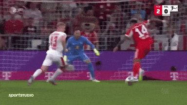 A Soccer Player With The Number 14 On His Jersey Is Kicking The Ball GIF
