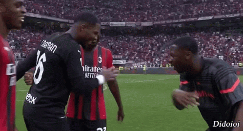 A Soccer Player With The Number 16 On His Back Is Hugging Another Player GIF