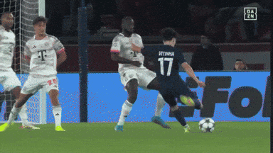 a soccer player with the number 17 on his jersey is kicking the ball