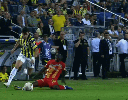 A Soccer Player With The Number 18 On His Jersey Is Kicking The Ball GIF