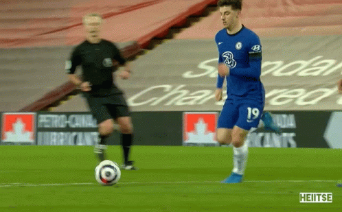 A Soccer Player With The Number 19 On His Jersey Is Kicking A Ball GIF