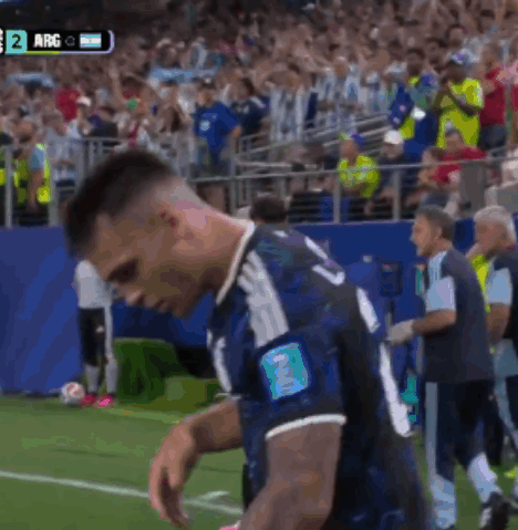 A Soccer Player With The Number 2 On His Arm Stands On The Field GIF