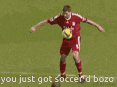 A Soccer Player With The Number 20 On His Back Is Kicking Another Player GIF