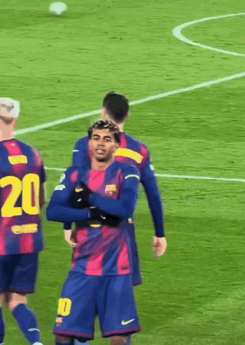 A Soccer Player With The Number 20 On His Jersey Is Hugging Another Player GIF