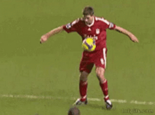 A Soccer Player With The Number 21 On His Back Kicks Another Player GIF