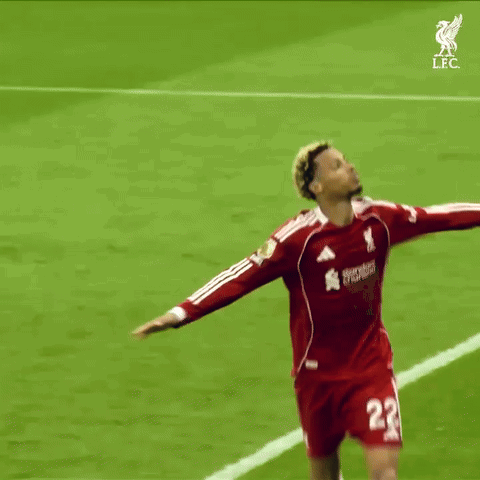 A Soccer Player With The Number 22 On His Jersey Reaches Up Towards The Sky GIF