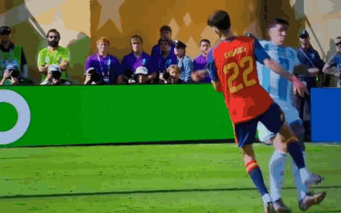 a soccer player with the number 22 on his shirt