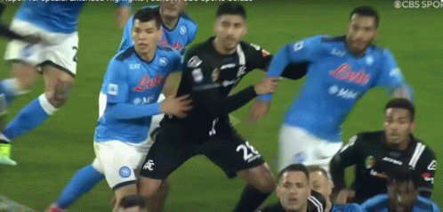 A Soccer Player With The Number 22 On His Shorts Is Being Tackled By Other Players GIF